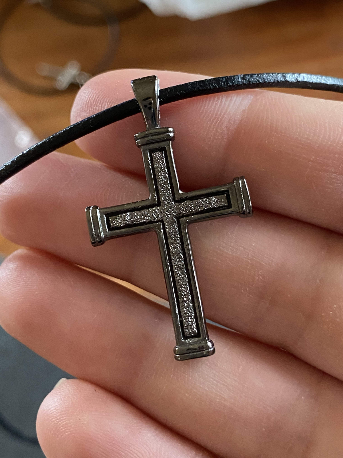 Men's black cross necklace with leather cord 