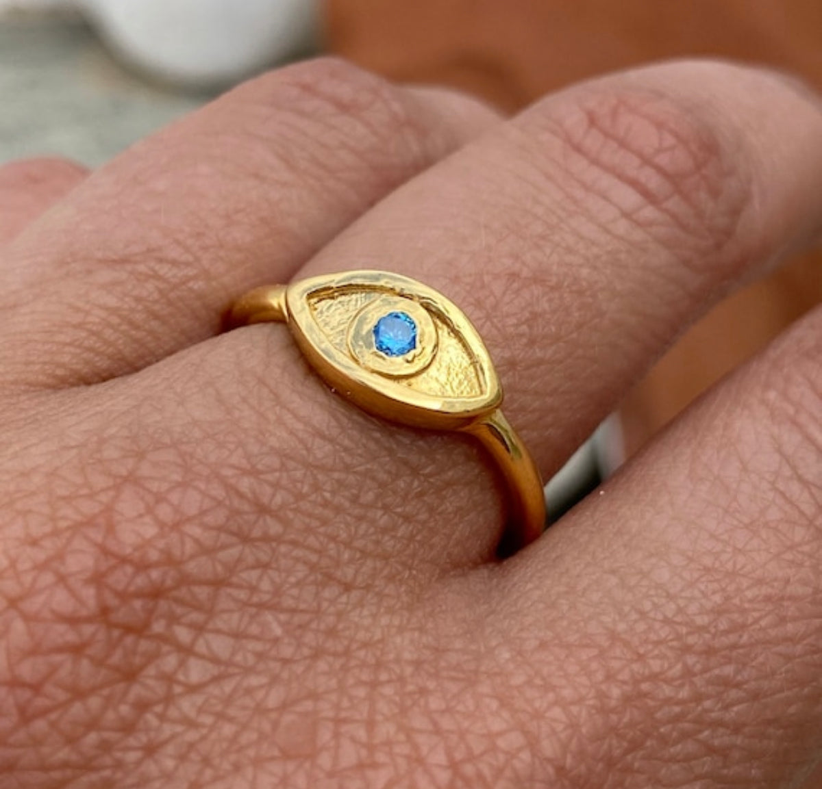 evils eye ring gold with blue gemstone