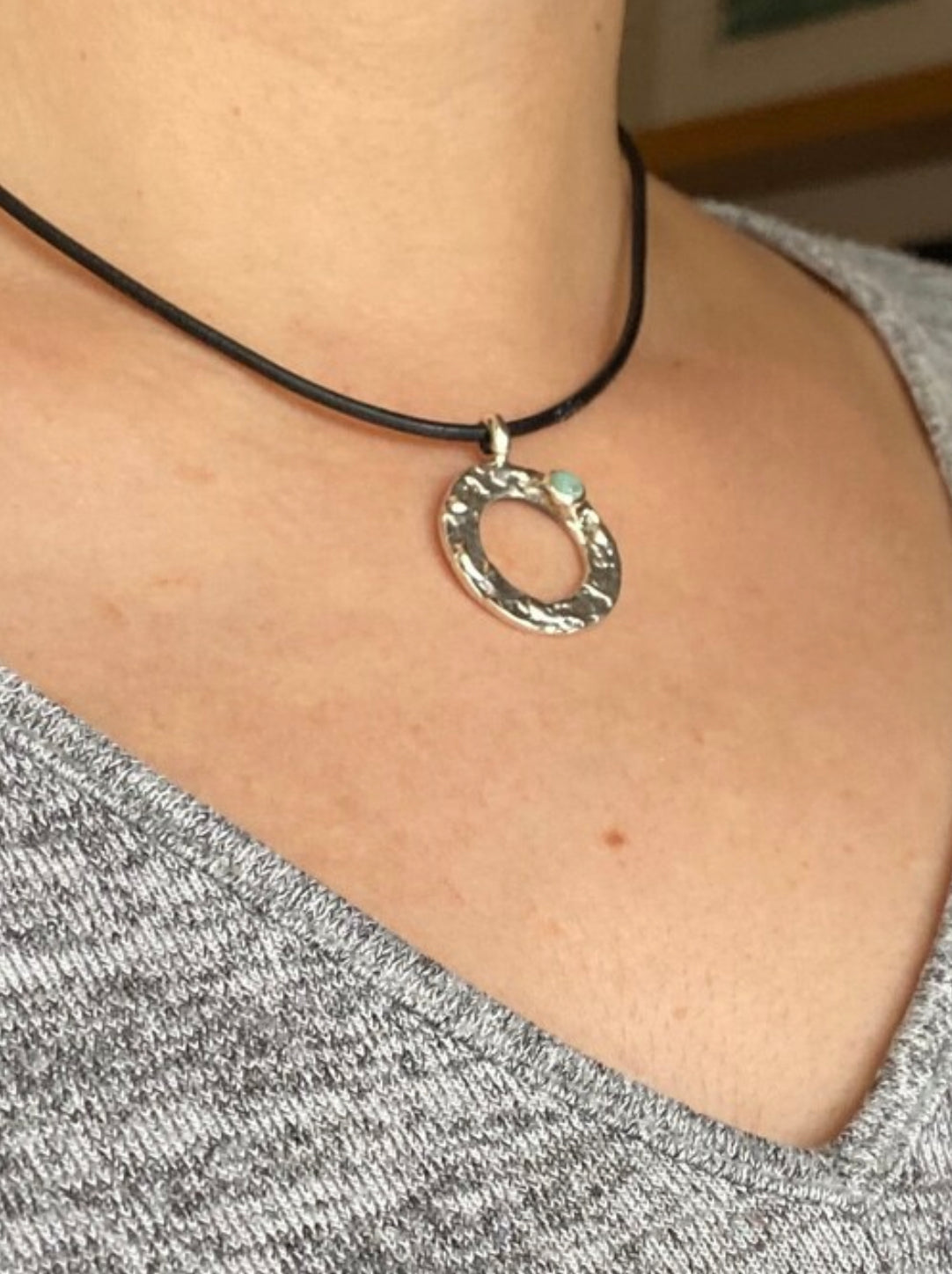 handmade circle necklace with a turquoise gemstone
