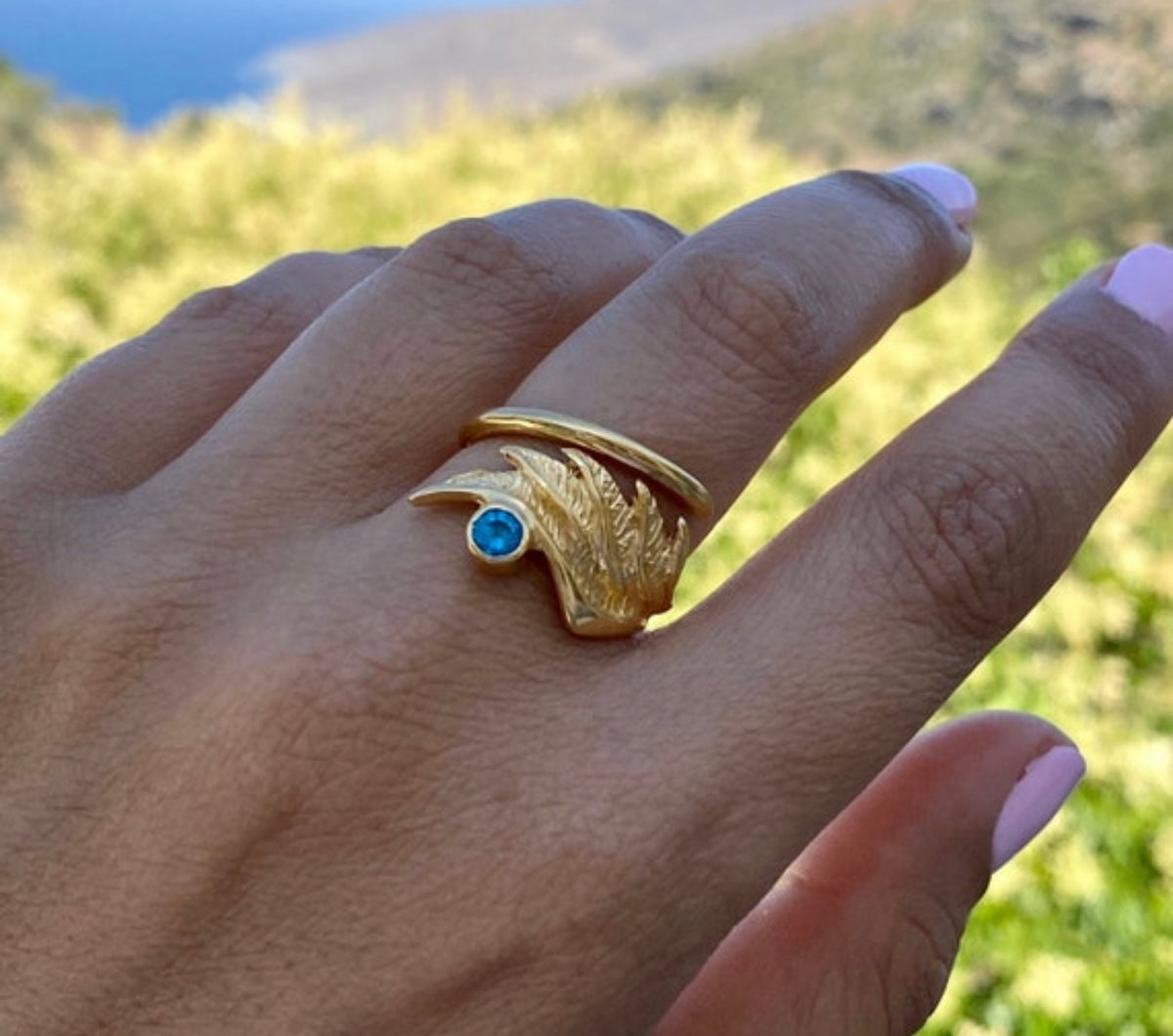 angel wing ring with blue gemstone