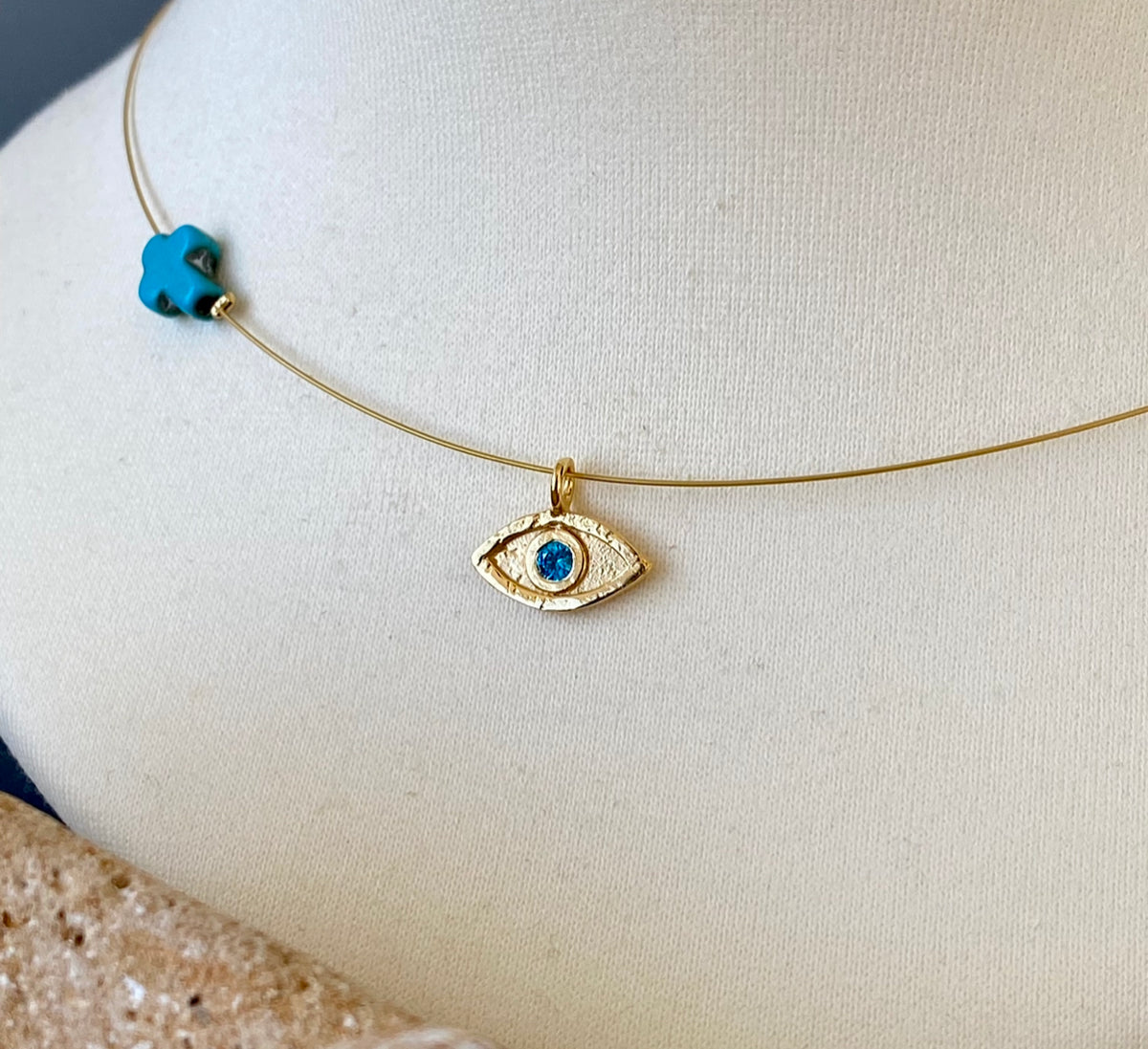 evil eye necklace gold with blue gem