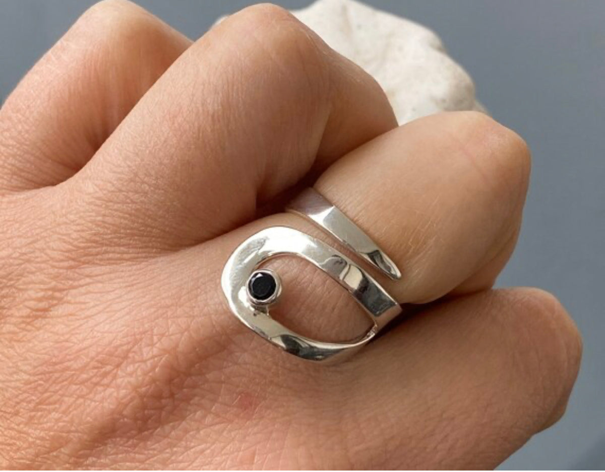 silver ring with black gemstone
