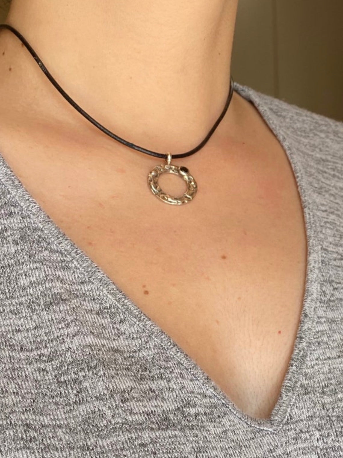 handmade circle necklace with a black gemstone
