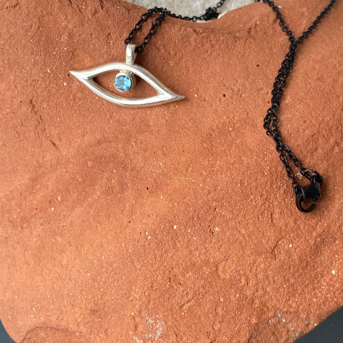 Evil eye necklace blue gem and black stainless steel chain