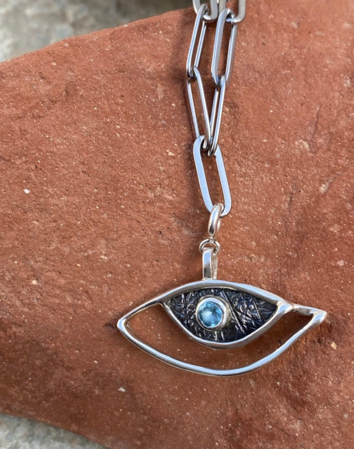 evil eye necklace with a paperclip chain